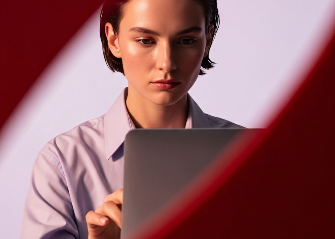 Student holding a tablet during an e-learning session