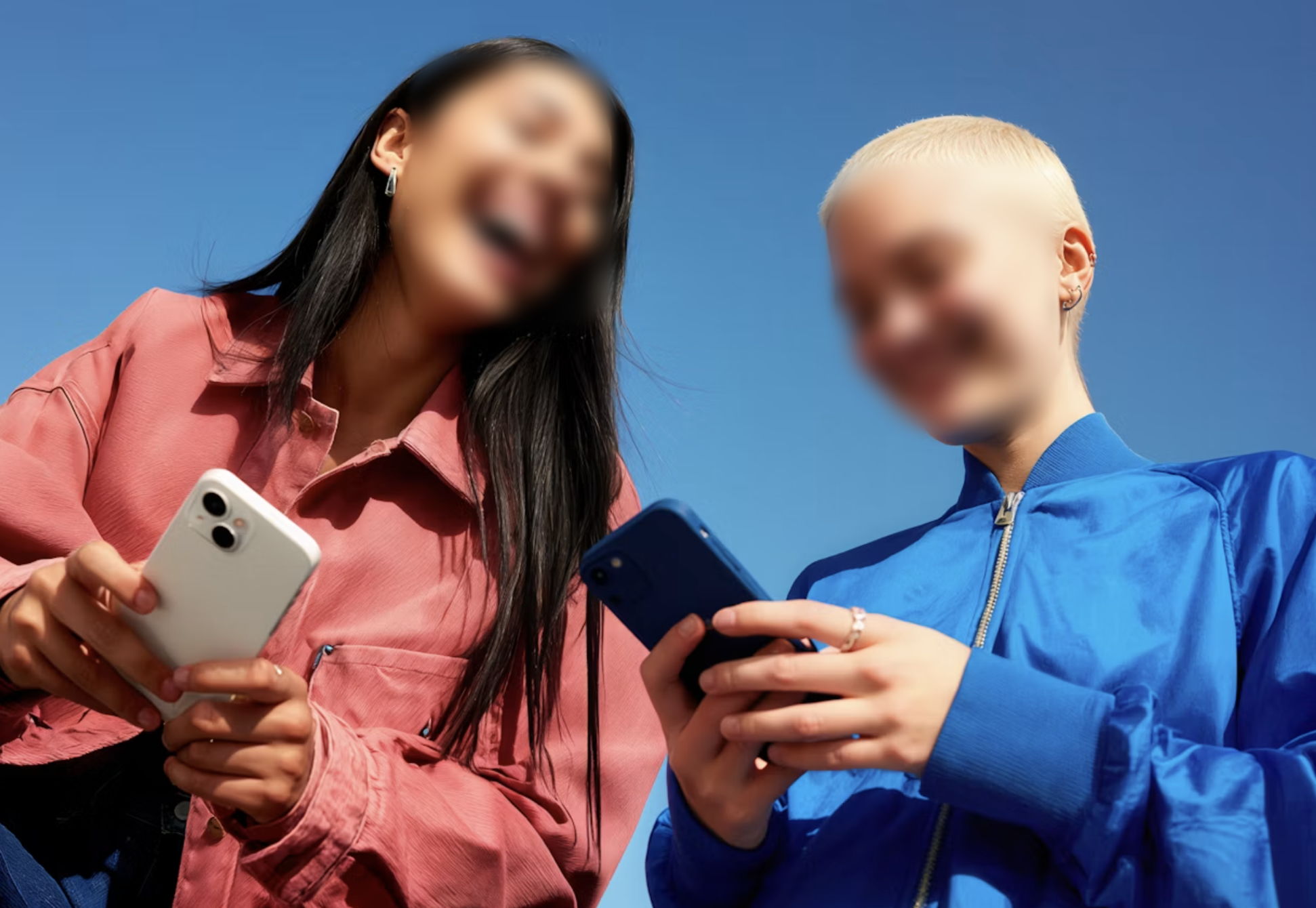 Two people photographed from below, both faces blurred by the CDN